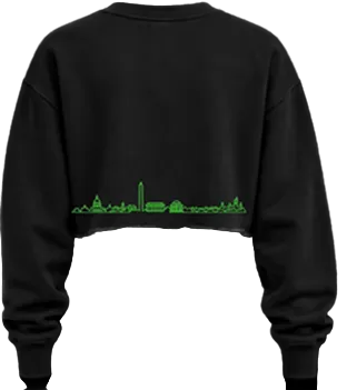 Black cropped sweatshirt with a green skyline graphic across the lower back, shown on a plain white background.