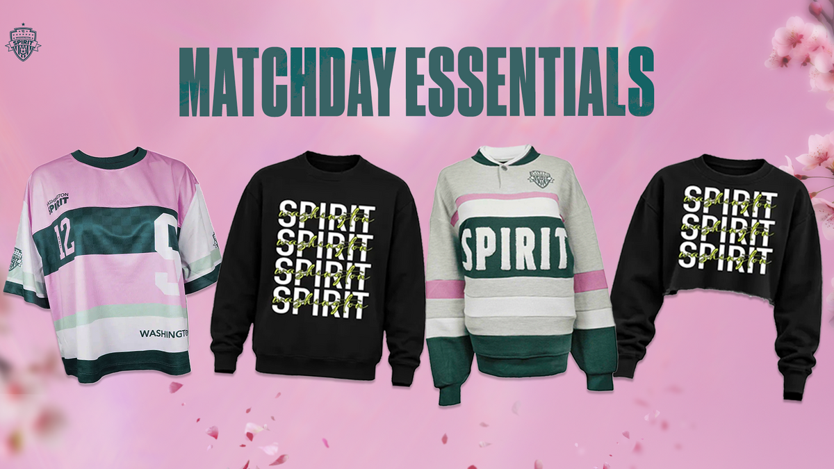 Four sports-themed apparel items displayed side by side under the text 'MATCHDAY ESSENTIALS' on a pink background with cherry blossom graphics. The products include a pink and white jersey-style top, a black long-sleeve shirt with 'SPIRIT' printed vertically in white, a light gray and green rugby-style top with 'SPIRIT' across the chest, and a black cropped sweatshirt with 'SPIRIT' printed vertically in yellow-green.
