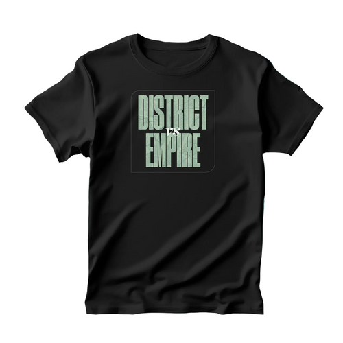 A black short-sleeve t-shirt with a graphic print reading 'DISTRICT VS EMPIRE' in a muted greenish-gray font, displayed flat against a dark teal background with text at the top reading 'DISTRICT VS. EMPIRE SHIRT DESIGN'.