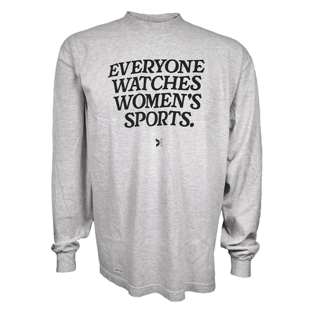 A light heather gray long-sleeve t-shirt with the text 'EVERYONE WATCHES WOMEN'S SPORTS.' printed in black across the chest, displayed on a solid white background.